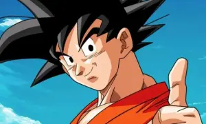 Goku, con su icónica ropa naranja y pulgar arriba, celebra el Goku Day bajo un cielo azul con nubes. ¡Un día para recordar!