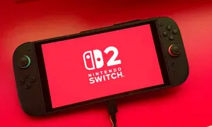 Nintendo Switch con logo "2" en pantalla roja. ¡Listo para nuevos juegos de Nintendo Switch 2!