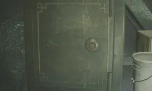 Caja fuerte verde con dial numérico y palanca, junto a un cubo blanco.