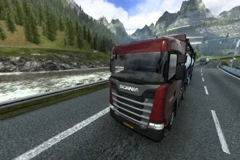Camión Scania rojo en una carretera montañosa, disfrutando de la experiencia de Euro Truck Simulator 2 en PS5.