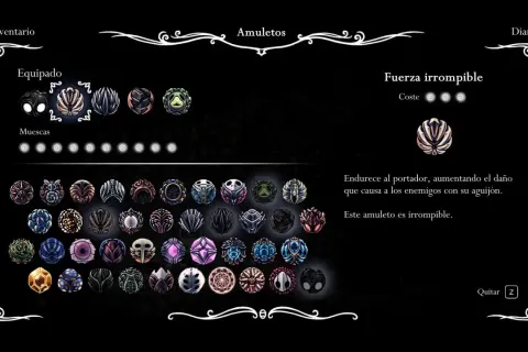 Inventario de amuletos de Grimm Hollow Knight. Se muestra el amuleto "Fuerza irrompible" equipado, que aumenta el daño del aguijón.