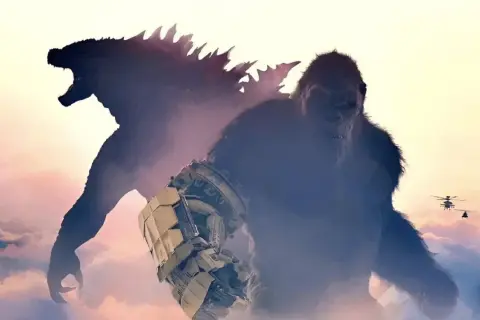 Kong con su guantelete mecánico y Godzilla emergen de las nubes, listos para la batalla en Godzilla y Kong: El Nuevo Imperio. Helicópteros sobrevuelan.
