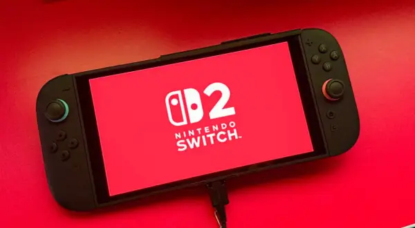 Nintendo Switch con logo "2" en pantalla roja. ¡Listo para nuevos juegos de Nintendo Switch 2!