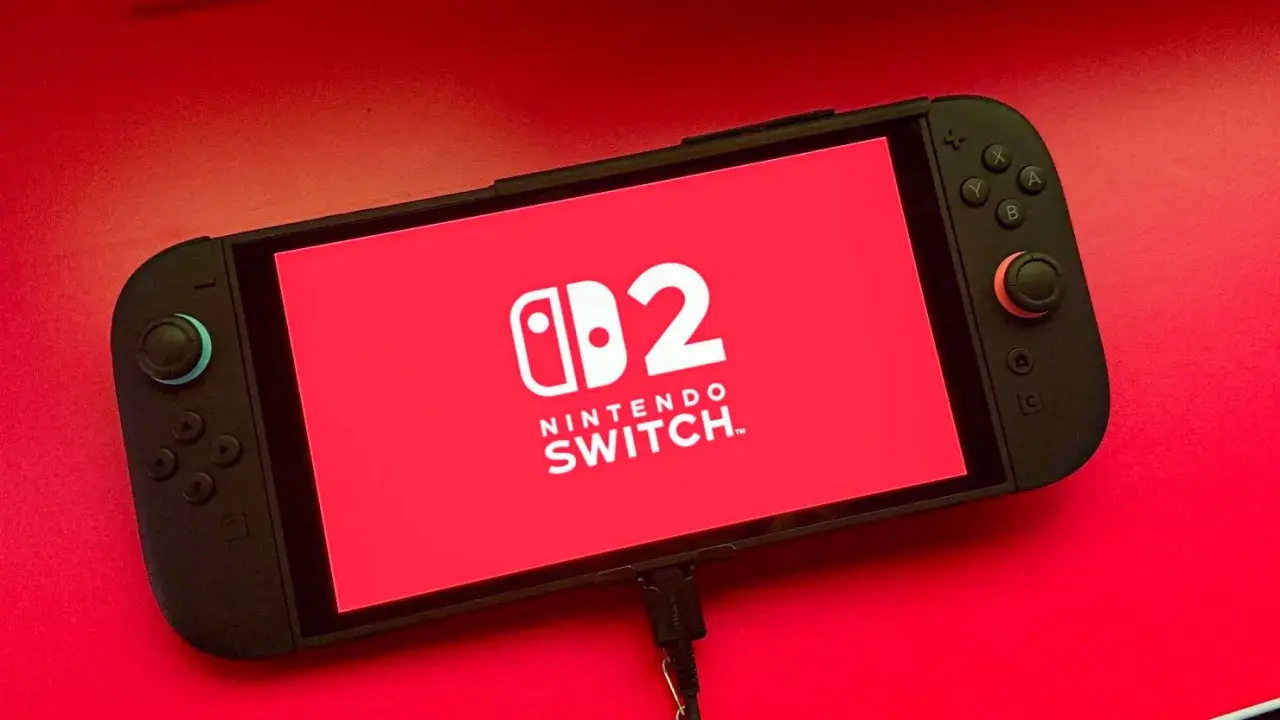 Nintendo Switch con logo "2" en pantalla roja. ¡Listo para nuevos juegos de Nintendo Switch 2!