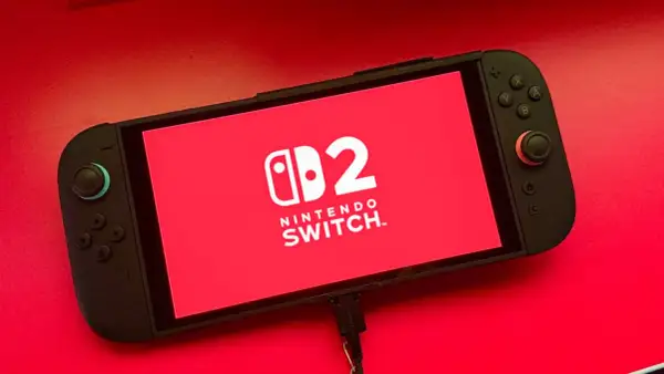 Nintendo Switch con logo "2" en pantalla roja. ¡Listo para nuevos juegos de Nintendo Switch 2!