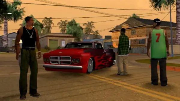 CJ y sus amigos planean cómo usar trucos de GTA San Andreas PS2 para conseguir ese coche rojo con llamas.